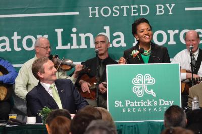 St Pats Bfeas: Irish Prime Minister Enda Kenny, left, looked on as Senator Linda Dorcena Forry spoke at last year’s South Boston St. Patrick’s Day Breakfast. Photo by Don West